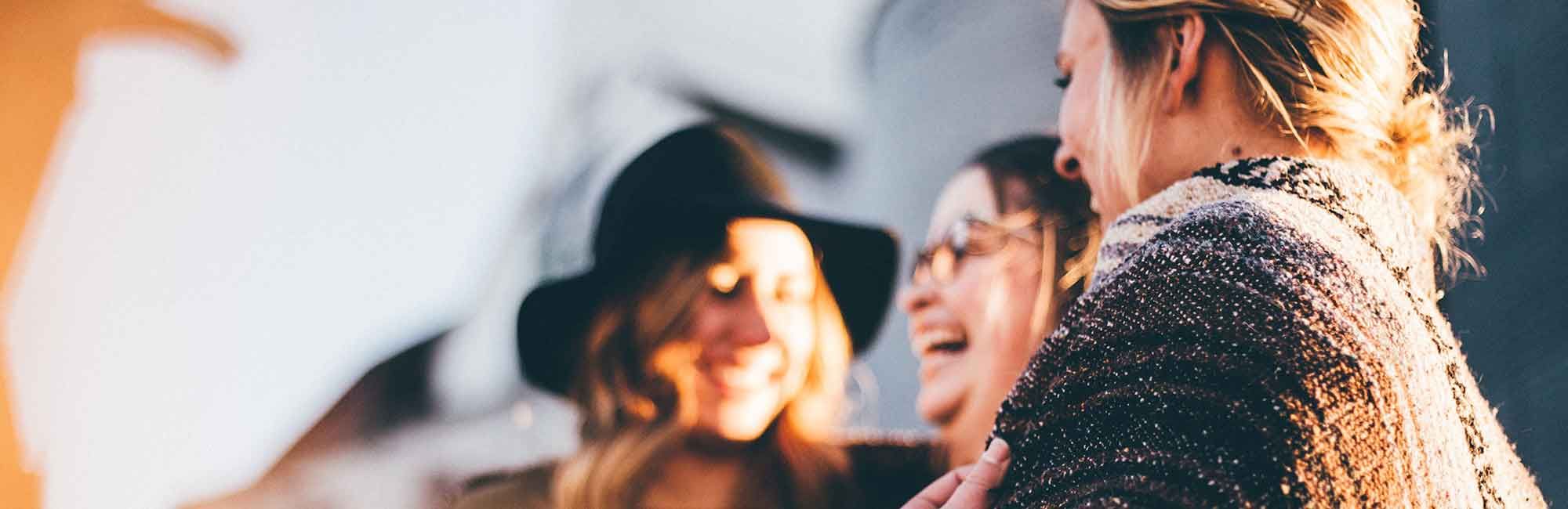 group of women laughing to each other